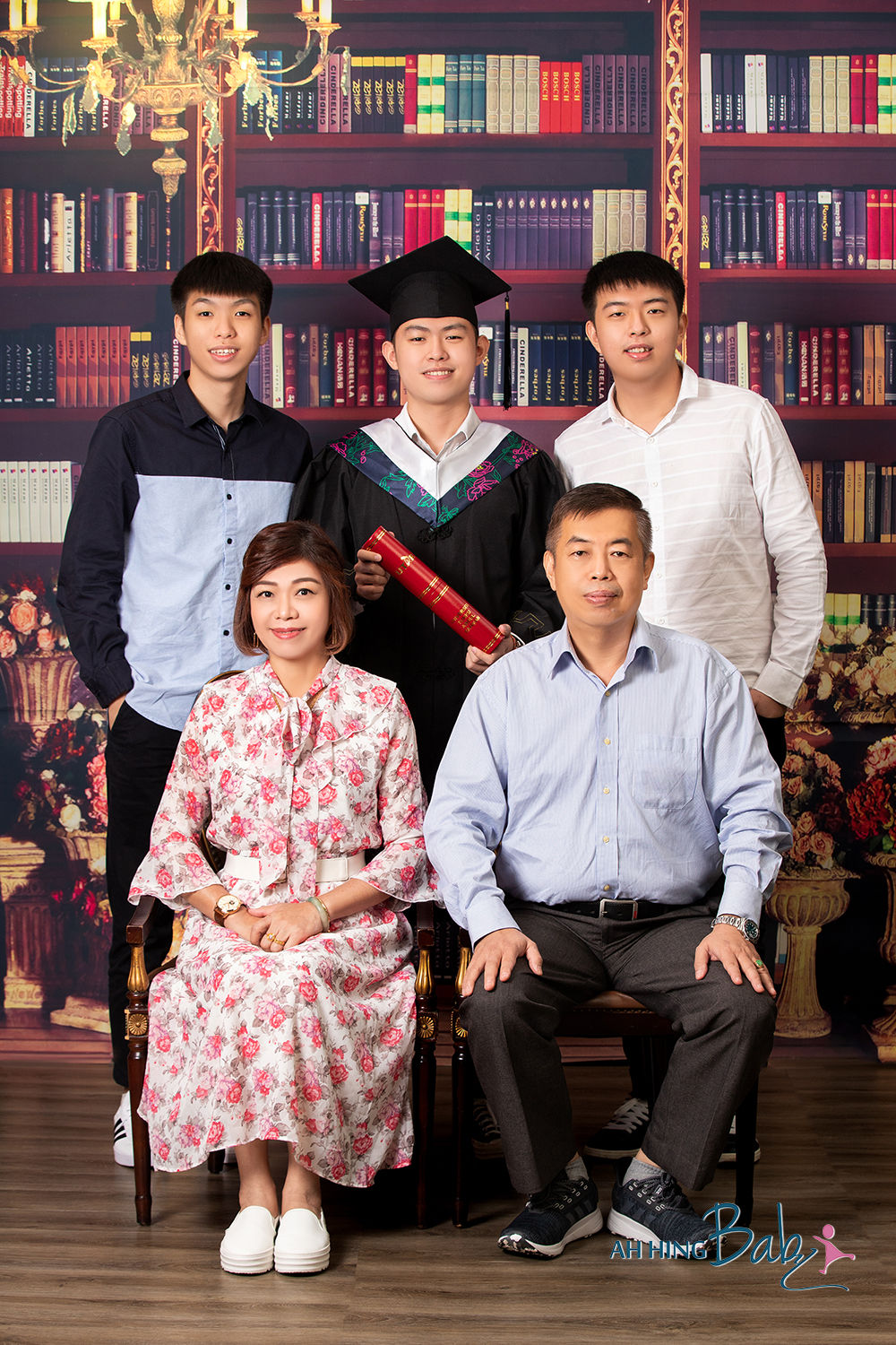 Graduate family portrait on library studio backdrop