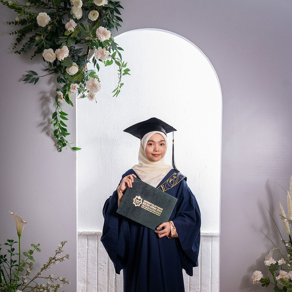 Convocation individual portrait with cap and gown