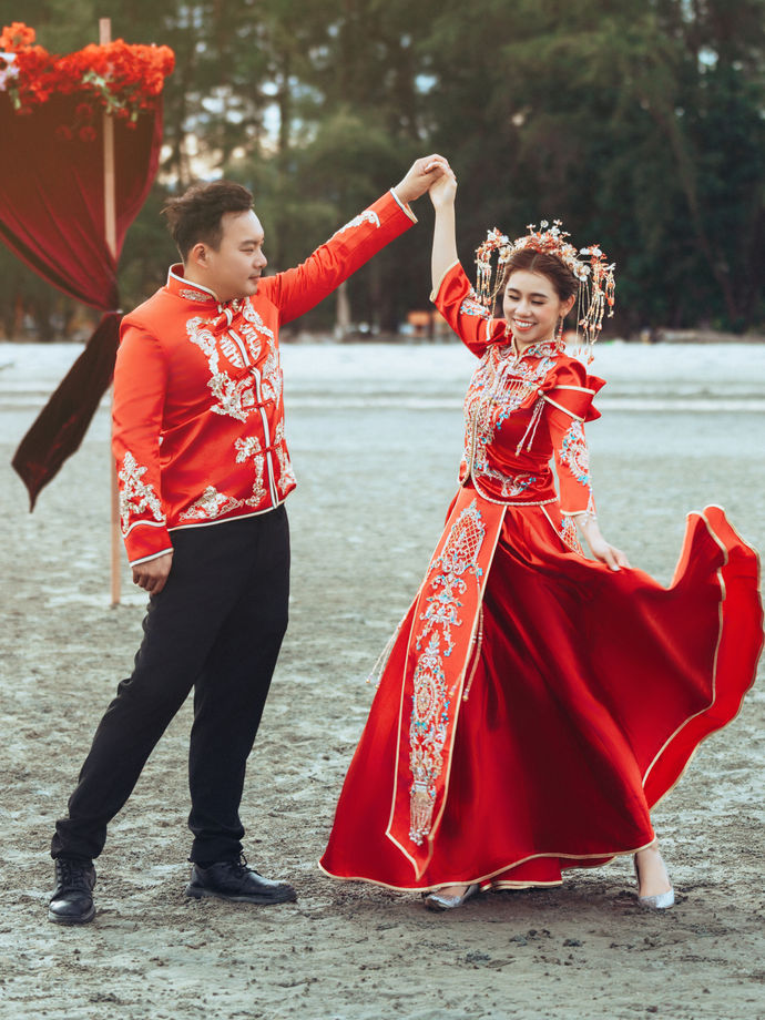 Beach pre-wedding setup with red Chinese bridal decor in Kuantan